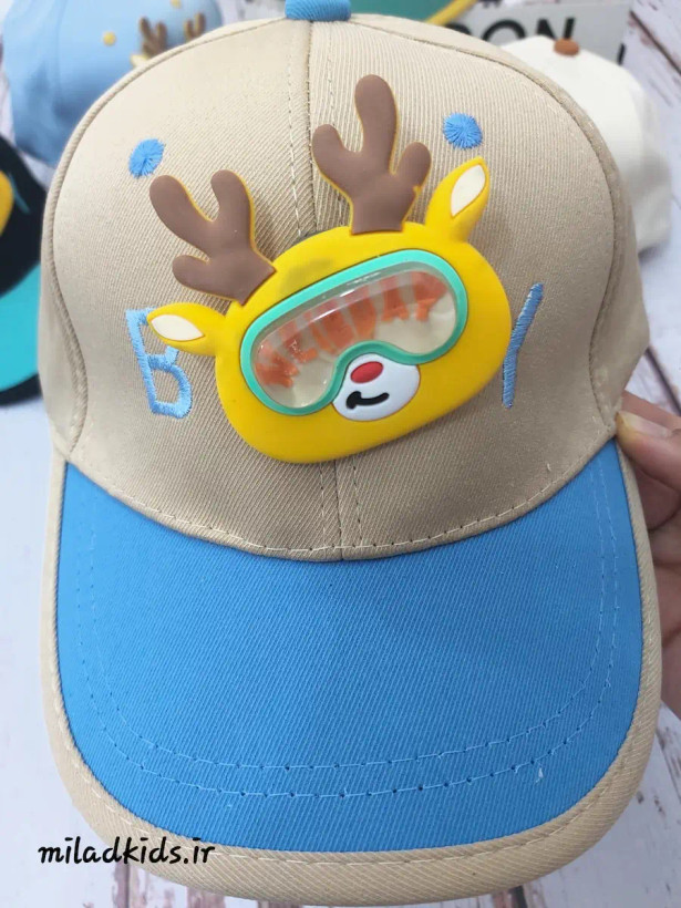 کلاه کپ کودک مدل عروسک گوزنی متحرک برجسته رنگ کرم-آبی نفتی